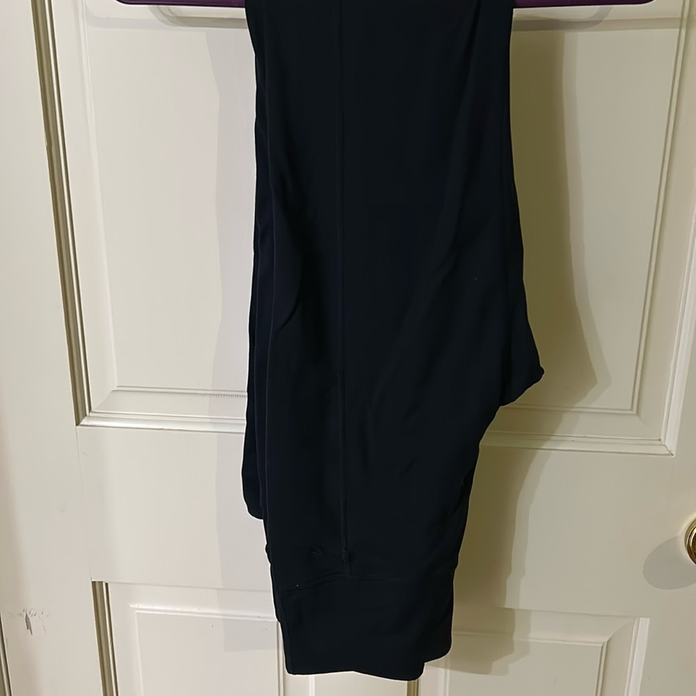 Skechers.  Small black.  2 front pockets.  2 back pockets.